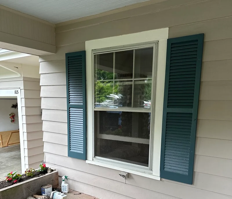 Old double hung window in Fairfield,CT with a metal roof